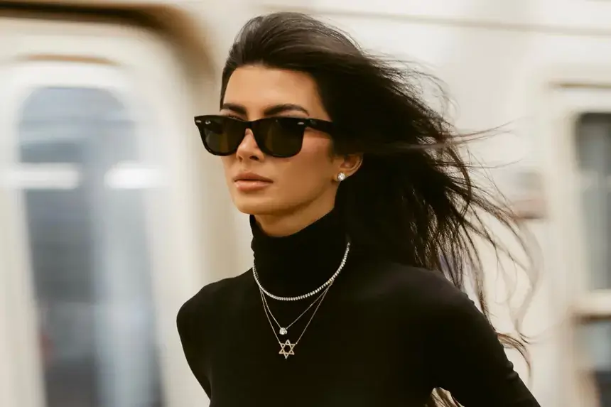Ellie Zeiler wearing black turtleneck and Star of David necklace — Ellie Zeiler net worth 2026
