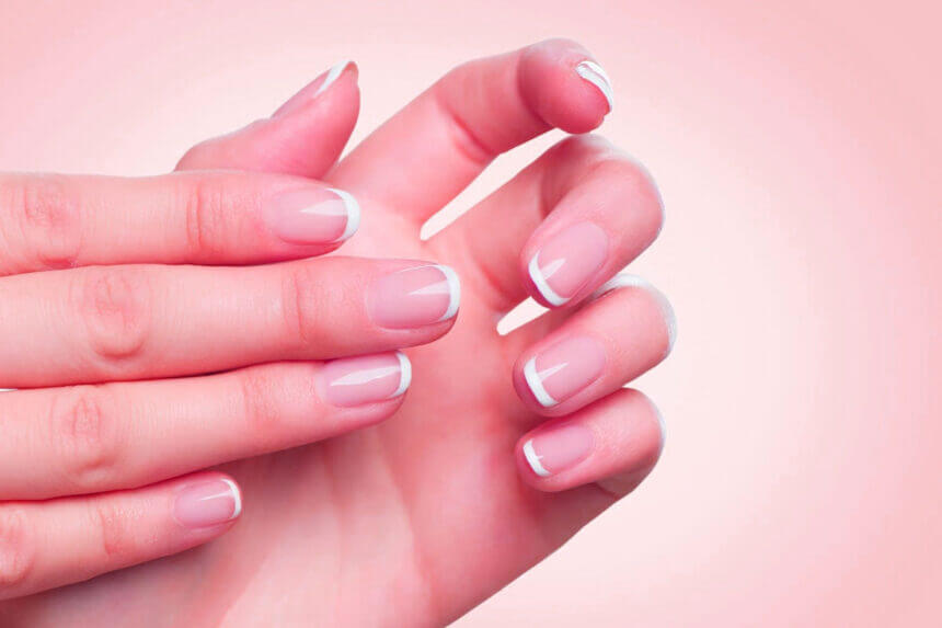 Gel Hard Gel nail enhancement application process showing UV curing light and professional nail tools for durable manicure