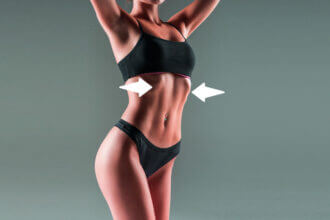 Person doing rib flare treatment exercises lying on back with hands on chest demonstrating proper breathing technique for rib cage correction