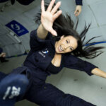 Angela White floating in zero gravity during parabolic flight experience showing her entrepreneurial ventures beyond traditional career