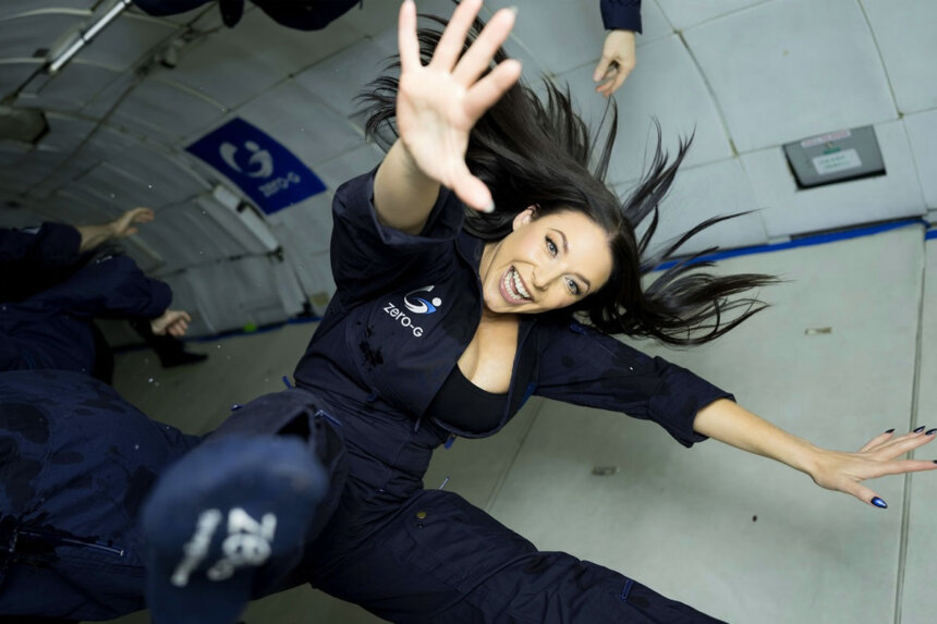 Angela White floating in zero gravity during parabolic flight experience showing her entrepreneurial ventures beyond traditional career