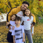 Austin McBroom net worth photo showing the former ACE Family YouTuber with his three children in autumn setting