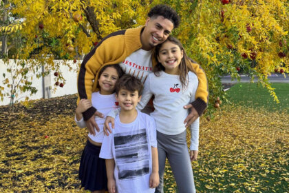 Austin McBroom net worth photo showing the former ACE Family YouTuber with his three children in autumn setting