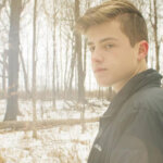 Braydon Wald commissioning engineer working on building systems verification at construction site