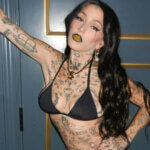 Brooke Candy net worth rapper performing on stage with microphone showing her music career earnings