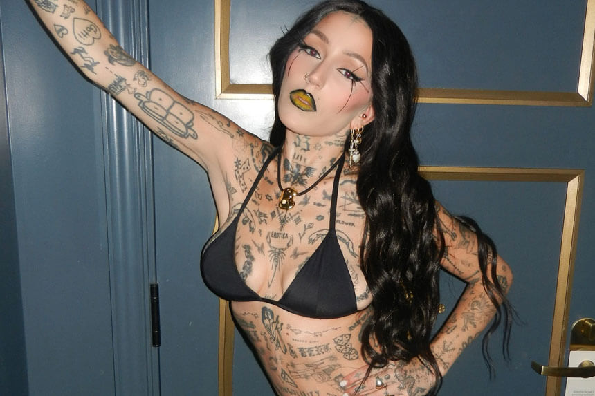 Brooke Candy net worth rapper performing on stage with microphone showing her music career earnings