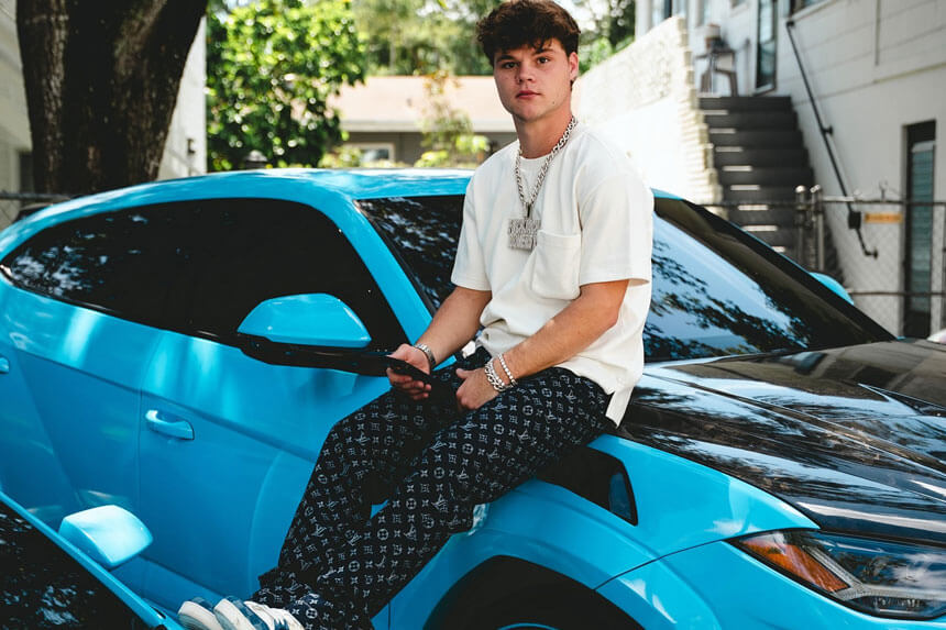 Jack Doherty net worth 2025 showing YouTuber with luxury cars and mansion reflecting his earnings from content creation