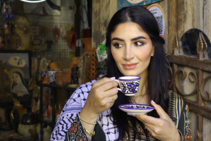 Linda Furrha holding traditional cup showcasing her lifestyle as social media influencer discussing Linda Furrha net worth 2025