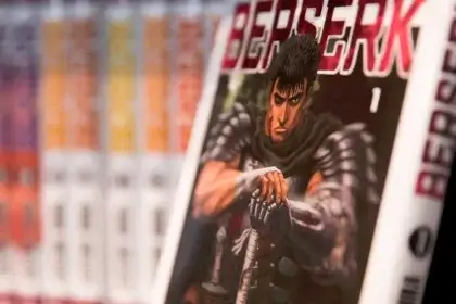 Berserk Manga volume cover featuring Guts the Black Swordsman in detailed armor illustration