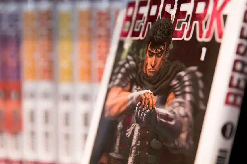 Berserk Manga volume cover featuring Guts the Black Swordsman in detailed armor illustration