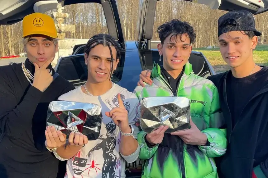 obre Brothers Net Worth - Four brothers Lucas, Marcus, Cyrus and Darius holding YouTube play buttons by luxury car