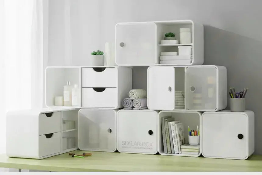 Slylar Box modular storage system with white stackable cubes, drawers, and compartments arranged on desk for home organization