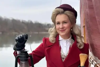 Ginna Claire Mason in costume portraying a character in period attire demonstrating her successful acting career that contributes to her net worth