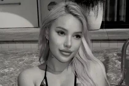 Kylie Page net worth subject blonde woman in athletic wear bikni in a pool showing lifestyle from her career earnings