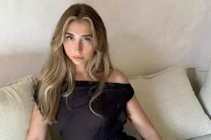 Lily Phillips net worth overview showing the OnlyFans content creator in casual setting discussing her financial success