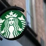 Starbucks logo sign on a brick wall representing the Starbucks Dumfries Closure in January 2025