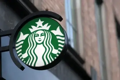 Starbucks logo sign on a brick wall representing the Starbucks Dumfries Closure in January 2025