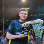 Who is s1mple - Oleksandr Kostyliev holding MVP award and CS:GO Major trophy at a live tournament