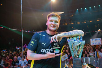 Who is s1mple - Oleksandr Kostyliev holding MVP award and CS:GO Major trophy at a live tournament