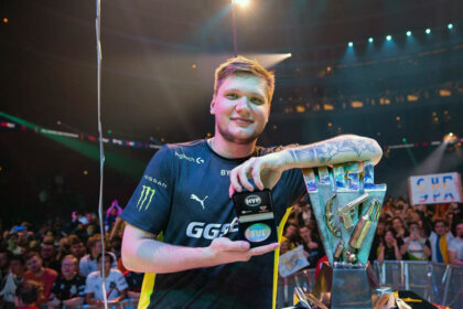 Who is s1mple - Oleksandr Kostyliev holding MVP award and CS:GO Major trophy at a live tournament