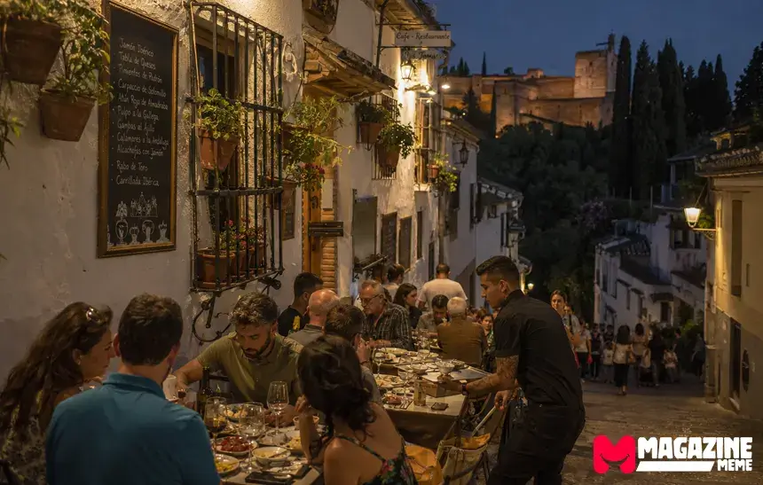 Outdoor restaurants and tourists in Granada’s Albaicín neighborhood after an Alhambra night tour