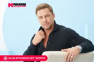 Alan Ritchson net worth profile photo in dark textured cardigan, seated portrait