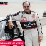 Dale Earnhardt in white and black racing suit beside his No. 3 Chevrolet on pit road