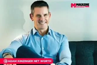 Adam Kinzinger smiling in a blue shirt on a couch, featured for his net worth article