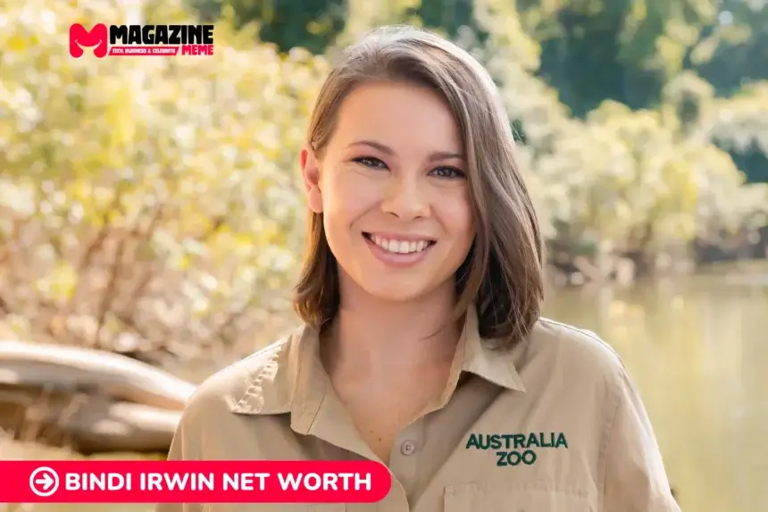 Bindi Irwin smiling outdoors in her Australia Zoo uniform, featured for the Bindi Irwin net worth article.