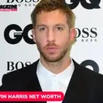 Calvin Harris in a black suit at a GQ and Boss event backdrop, Calvin Harris net worth article portrait.