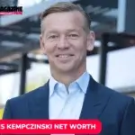 Chris Kempczinski smiling outside a McDonald's location, featured for the net worth article.