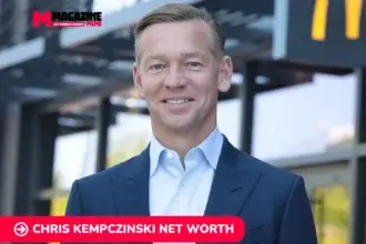 Chris Kempczinski smiling outside a McDonald's location, featured for the net worth article.