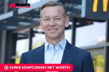 Chris Kempczinski smiling outside a McDonald's location, featured for the net worth article.