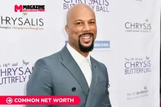 Common net worth smiling in a grey suit at a charity red carpet, Common article portrait.