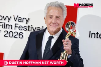 Dustin Hoffman net worth in a dark suit holding a glass and gold trophy at a film festival, for the Dustin Hoffman article.