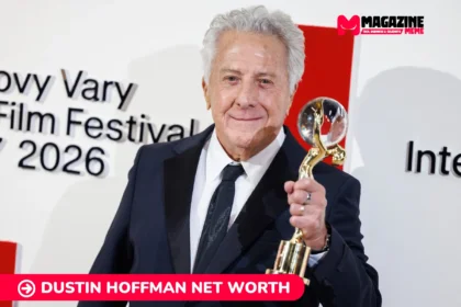 Dustin Hoffman net worth in a dark suit holding a glass and gold trophy at a film festival, for the Dustin Hoffman article.