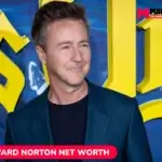 Edward Norton net worth smiling in a teal blazer for the Edward Norton article.