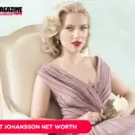 Scarlett Johansson Net Worth article portrait: seated woman in mauve gown holding a