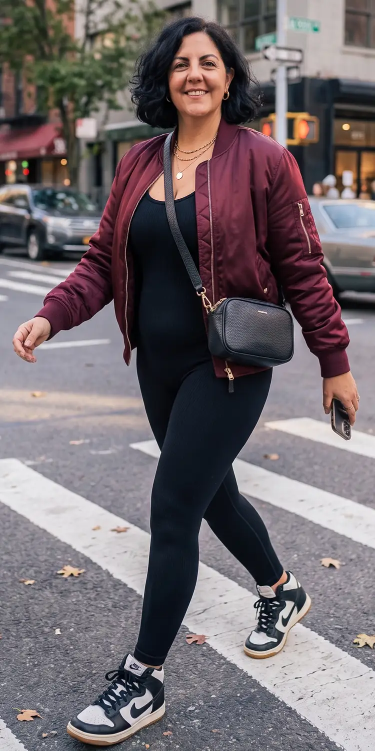 Fitted Bomber Jacket Layered Over a Ribbed Knit Unitard and Retro High-Tops